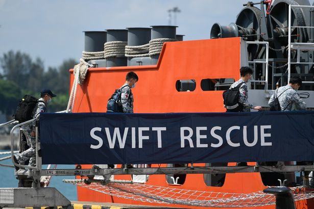 Officers board Singapore Navy's MV Swift Rescue ahead of rescue efforts