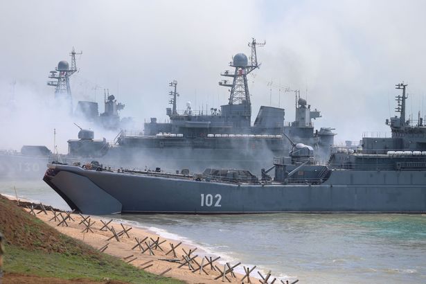 Russian forces landing ashore during a military drill along the Opuk training ground