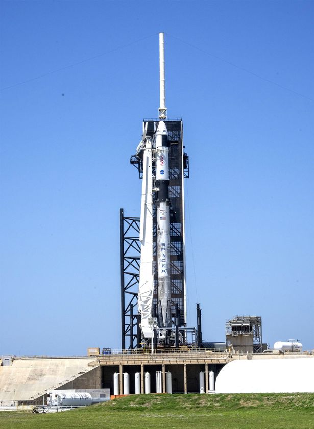 The SpaceX Falcon 9 with a Crew Dragon capsule stands poised to launch on Complex 39A at the Kennedy Space Center