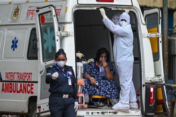 A health worker in Mumbai, India, as the country battles a devastating wave of coronavirus cases