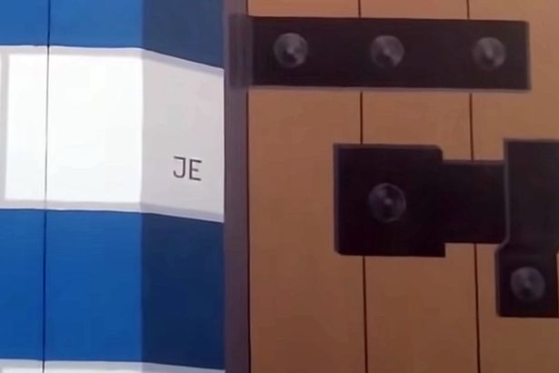 The initials JE inscribed on a building on a private island used by Jeffrey Epstein