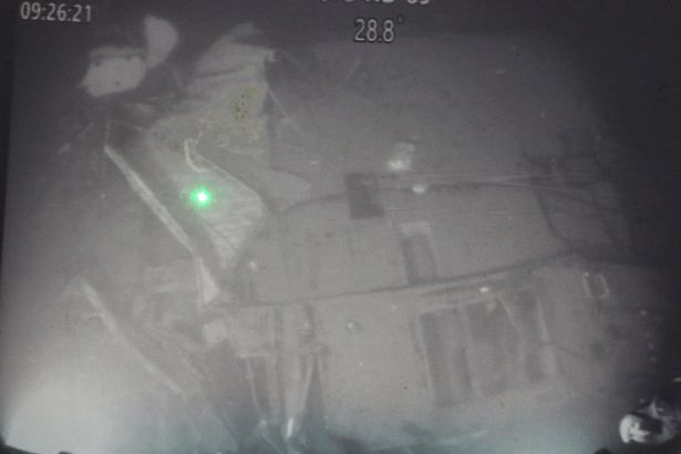 Green light shows part of the ship underwater in Bail sea