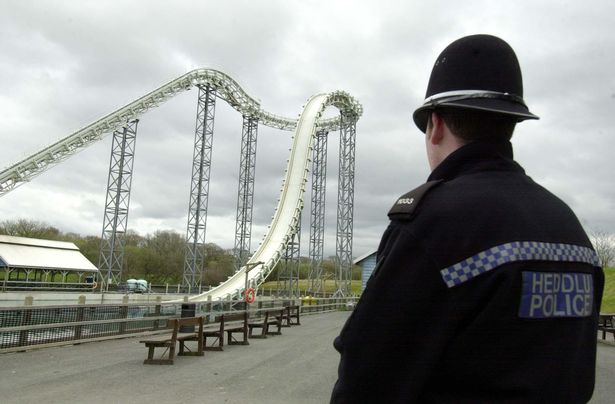 A police officer stands guard at the Hydro ride at Oakwood Leisure Park, in west Wales