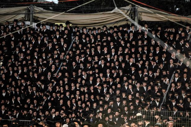 Thousands of ultra-Orthodox Jews gathered at the grave site