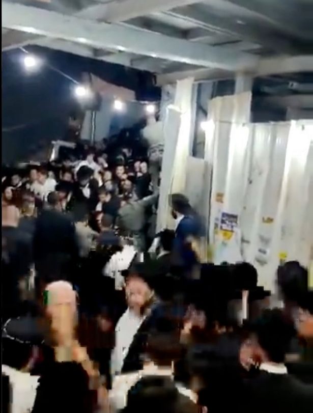 Footage shows chaos and captures panicked screams as Lag B'Omer bonfire festivalgoers are caught in a crush