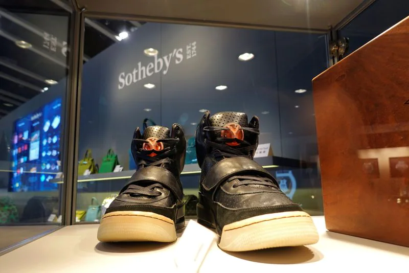 FILE PHOTO: A pair of 'Nike Air Yeezy 1' prototype sneakers designed by Kanye West, are displayed at the Hong Kong Convention and Exhibition Centre before going up for private sale at Sotheby's, in Hong Kong, China April 16, 2021. (REUTERS)