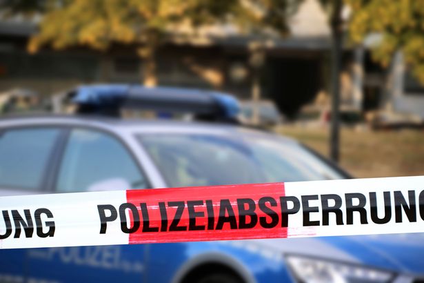 Cordon tape with the word „Polizeiabsperrung“, the german word for police cordon