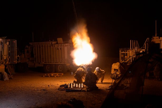 Sending a message as the illuminating
shells show troops are there