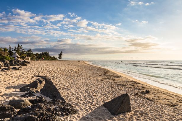 The sandy beach in Saint Gilles les Bains, a famous resort town in the Reunion island, an oversea France department in the Indian Ocean off the coast of Africa.