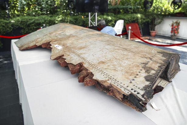 A piece of debris belong to MH370 is displayed during a remembrance ceremony to mark the fifth anniversary of its disappearance