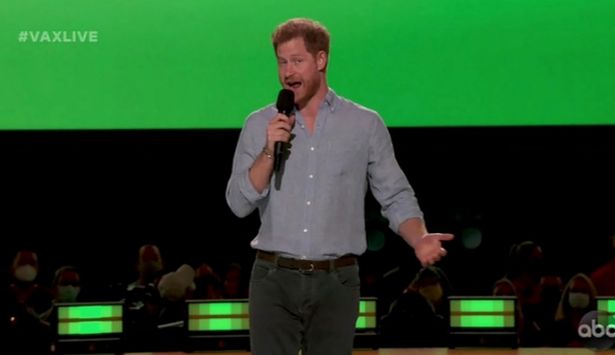 Prince Harry speaking into microphone at Vax Live event