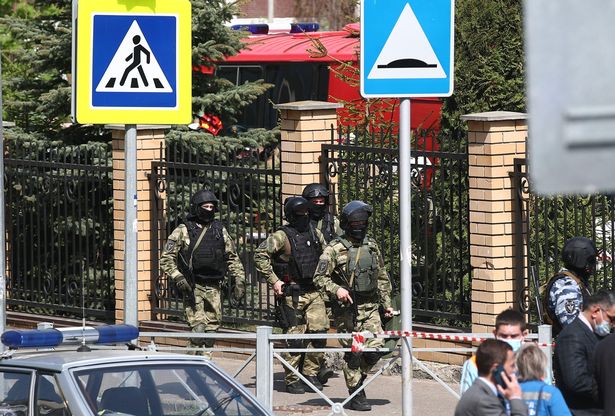 Heavily-armed officers arrive at the scene of a school shooting in Kazan