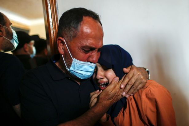 Relatives mourn during the funeral of Palestinian boy Hussien Hamad, who was killed in the northern Gaza Strip on Tuesday