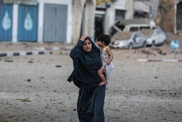 Palestinians leave their neighbourhood to head to a safer location as Israeli warplanes continue air strikes on Gaza Strip,