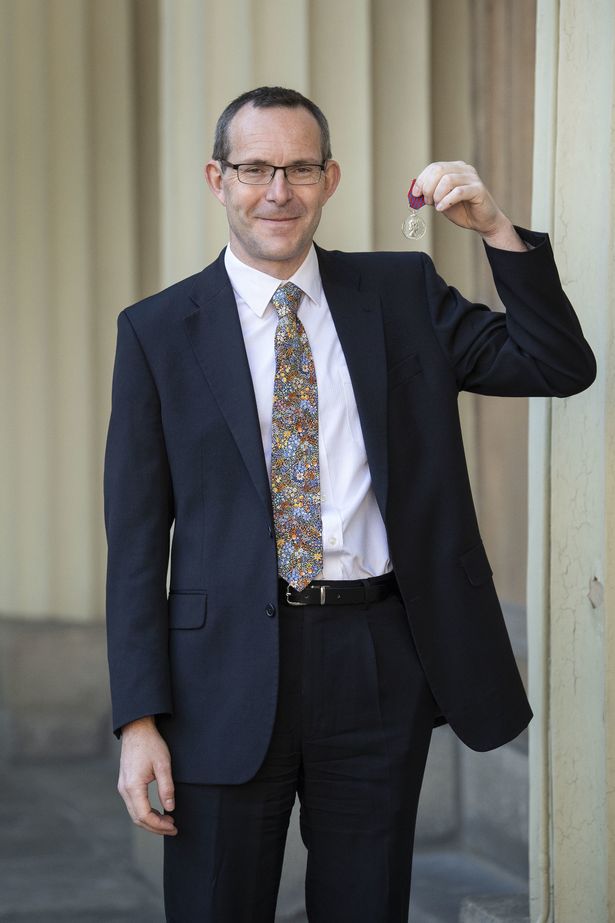 John with the George Medal following a ceremony at Buckingham Palace on February 26, 2019