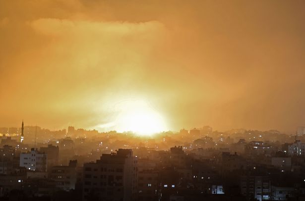 An explosion lights the sky following an Israeli air strike