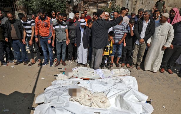 Toddlers' bodies were laid out on the ground ahead of their funeral in Beit Lahia