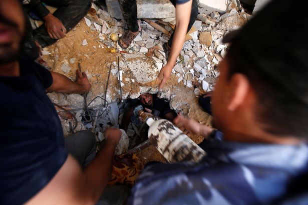 Rescuers search for people in the rubble