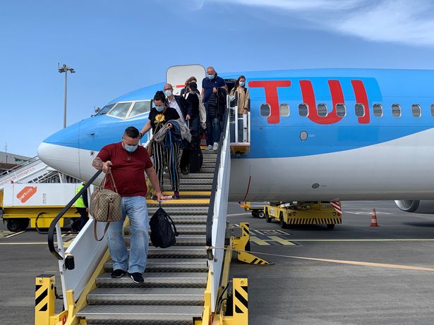 holidaymakers disembarking from their London Gatwick flight in Madeira