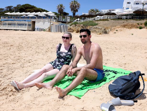 Emma Kelleher and partner Fabian Fowler on the beach