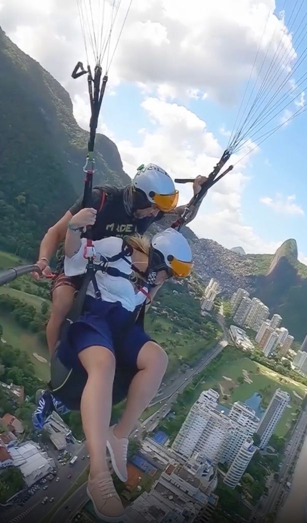 Woman and instructor paragliding