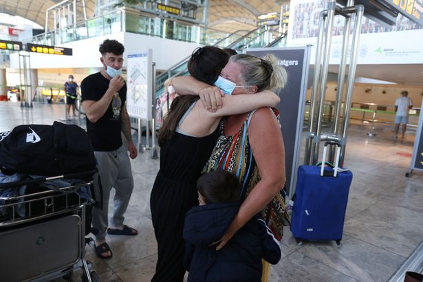 Alicante-based Jacqueline, 67, greets her daughter-in-law and grandchildren after six months apart