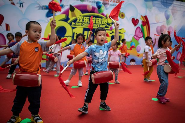 Children take part in a rehearsal for a children's day performance