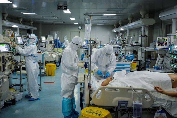 Patients infected by Covid-19 are treated at a hospital in Wuhan in China's central Hubei province in February 2020