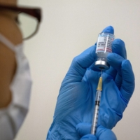 While those with underlying conditions will generally be given priority, 'if we wait until everyone (with underlying conditions) has been vaccinated, we don't know when it will be completed,' the health minister said. | BLOOMBERG