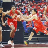 Yuki Togashi of the Chiba Jets makes a play on the ball against the Utsunomiya Brex during Game 1 of the B. League championship series on Saturday at Yokohama Arena.  | KYODO