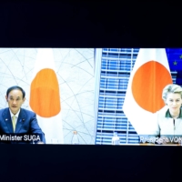 Japanese Prime Minister Yoshihide Suga and European Commission President Ursula von der Leyen take part in an EU-Japan videoconference summit at the European Council headquarters in Brussels on Thursday.  | POOL VIA / REUTERS