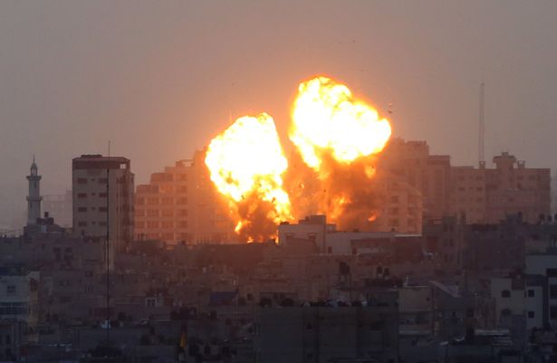 Smoke and flame rise after Israeli warplanes conducted airstrikes in Gaza City, Gaza on May 11, 2021