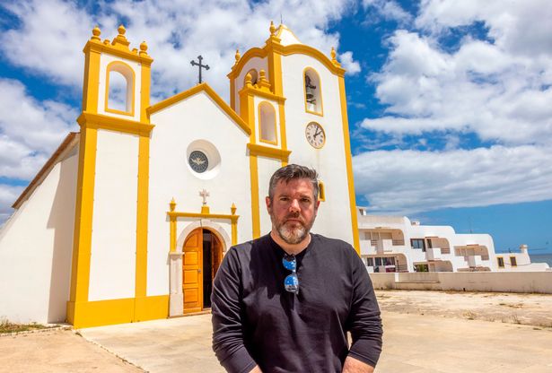 The Mirror's Martin Fricker outside the church, Nossa Senhora da Luz, which Madeleine’s parents Gerry and Kate McCann attended after her disappearance