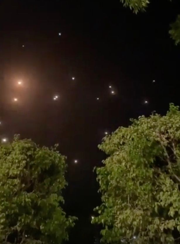 The Tel Aviv sky is lit up by missile defences to intercept rockets from Gaza