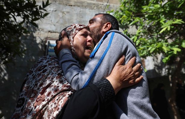 Relatives mourn the death of a member of the Al-Aqsa Martyrs' Brigades, the armed wing of the Palestinian Fatah movement, Mahmoud Abu Jrad, during his funeral in Beit Hanun in the northern Gaza Strip after he died from wounds sustained during the latest conflict with Israel