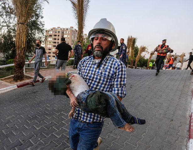 A child who was killed during an Israeli airstrike is being brought to Al-Shifa hospital