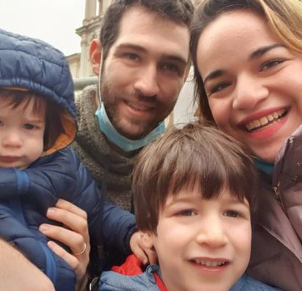 Parents Amit Biran and Tal Peleg-Biran pose for a selfie with their son Tom, two, and Eitan, five