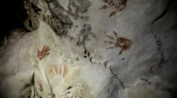 Handprints thought to be 1,200 years old are seen on cave walls in Merida, Mexico