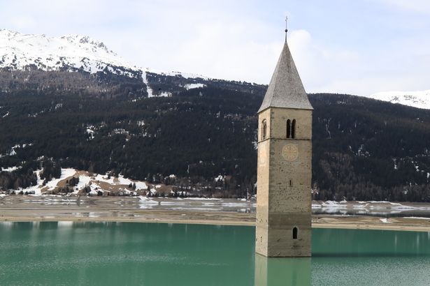 All that can be seen of the village normally is the church spire poking out of the water