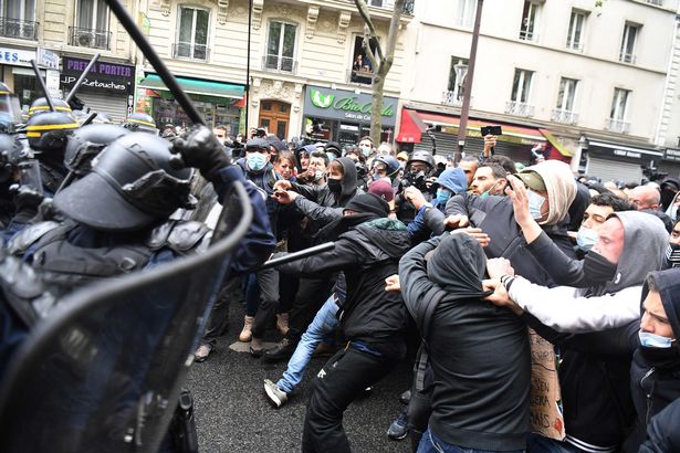 Protesters clash with police during the annual May Day (Labour Day) rally in Paris