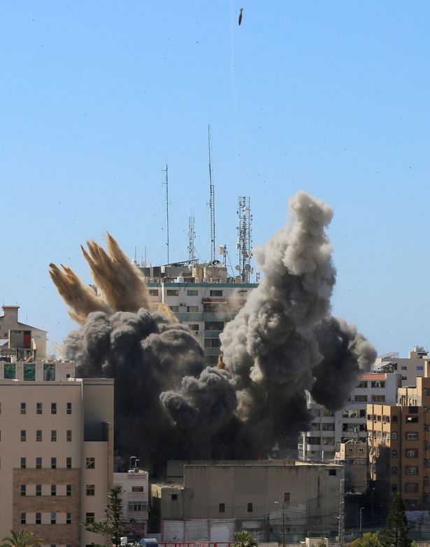 Three heavy missiles levelled the 12-storey building in Gaza