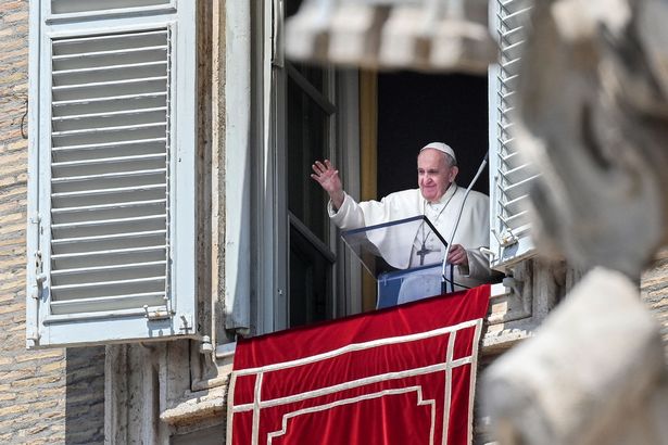 Pope Francis waving from his window in Italy