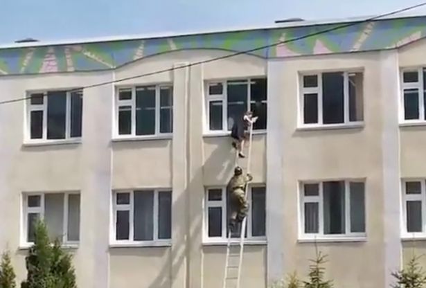 People escape a school shooting in Kazan