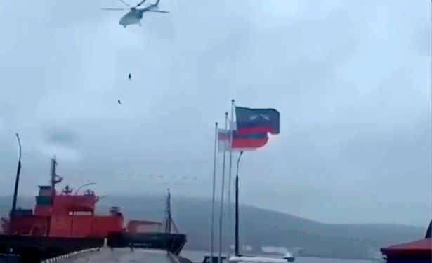 The guards descend a helicopter during the training operation