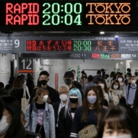 A train station in Tokyo on Friday. The government is considering keeping quasi-emergency measures in place for in the capital and other areas even if the state of emergency is lifted June 20 as planned.  | REUTERS