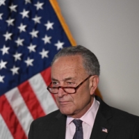 Senate Majority Leader Chuck Schumer speaks at a news conference in Washington on Tuesday.  | AFP-JIJI