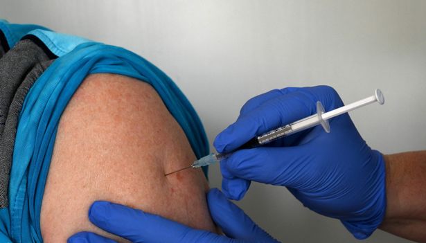 A man receives the Pfizer-BioNTech COVID-19 Vaccine