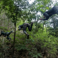 Anti-coup activists undergo basic military training at a camp of the Karen National Union, an ethnic rebel group, in Karen state in May. | AFP-JIJI