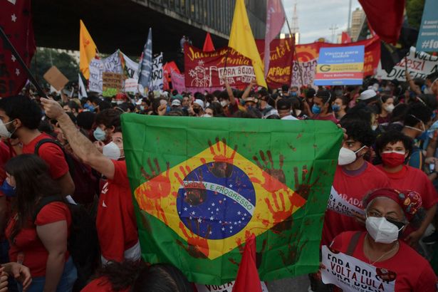 Demonstrators take part in a protest against Brazilian President Jair Bolsonaro's handling of the Covid-19 pandemic in Sao Paulo, Brazil