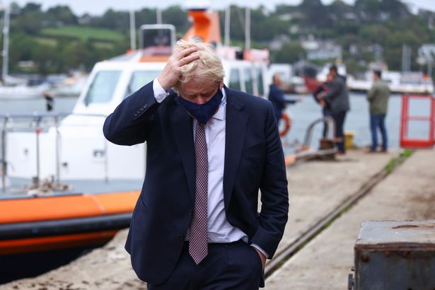 Britain's Prime Minister Boris Johnson arrives to visit the workshop of Scott Woyka, ahead of the G7 summit, in Falmouth, Cornwall, Britain June 10, 2021.